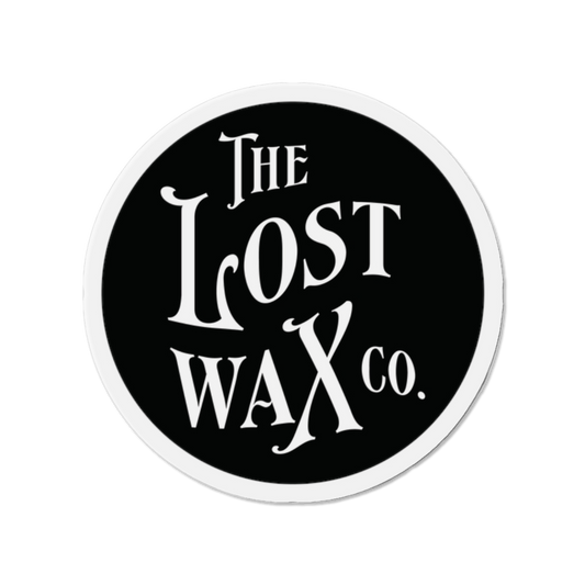 Round magnet with 'The Lost Wax Co.' text on a black background