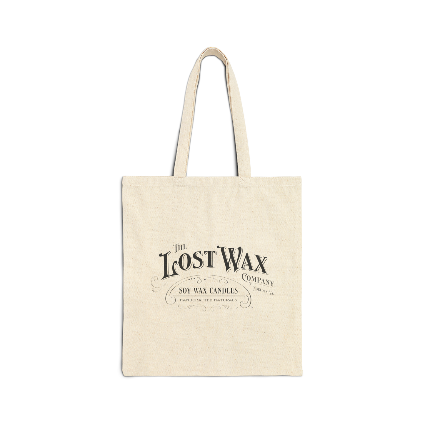 Beige tote bag with 'The Lost Wax Company' logo on a white background