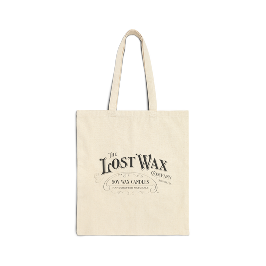 Beige tote bag with 'The Lost Wax Company' logo on a white background