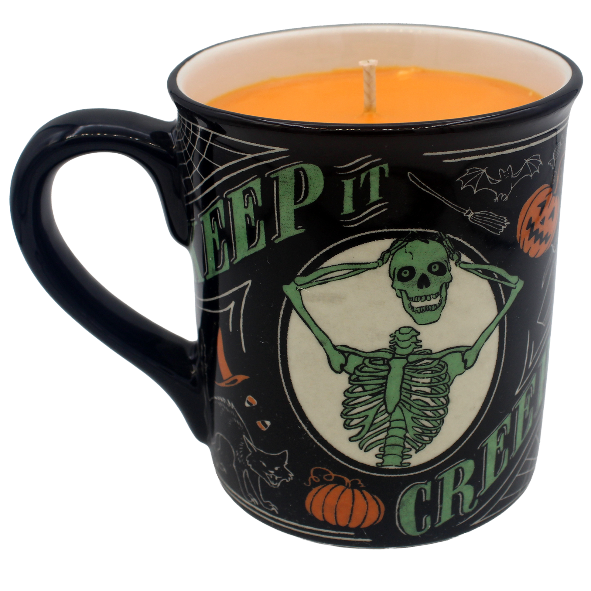 A black ceramic candle mug with a Halloween design, featuring a green skeleton graphic, pumpkins, bats, and the words 'SLEEP IT CREEP IT' on a white background.