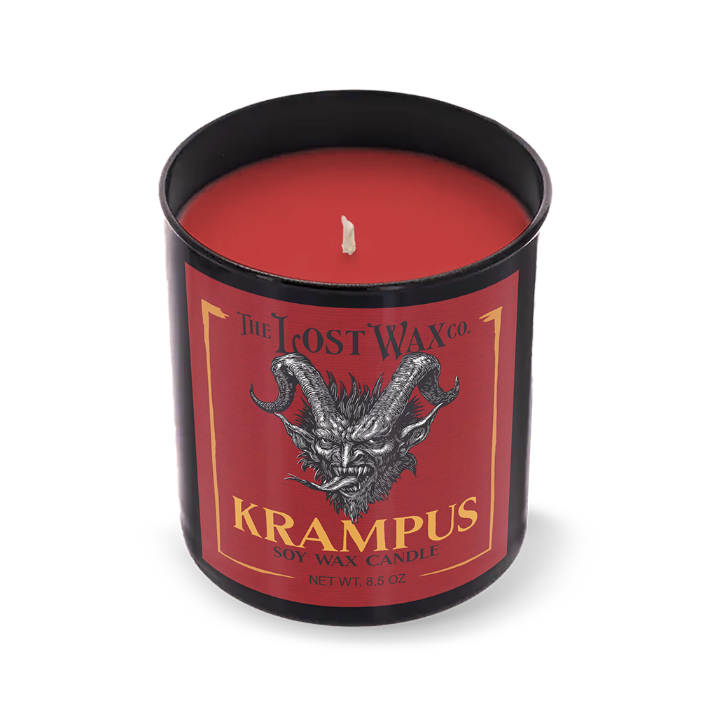 Red candle in a black container with 'Krampus' label on a white background