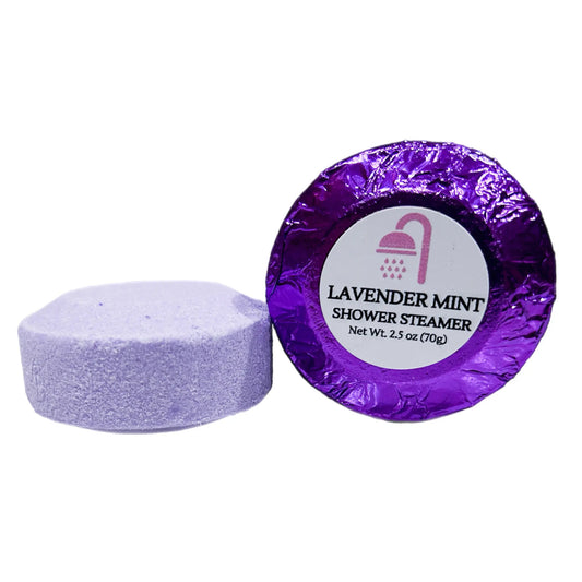 Purple shower steamer next to a wrapped "Lavender Mint" package