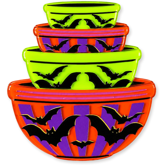 Three nested Halloween-themed bowls with a neon lime green, orange, purple, and black bat pattern, shown on a solid white background.