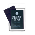 A package of Lost Wax Co. Midnight Moon wax melts, featuring a dark green label with white text inside a clear plastic clamshell container, with a dark purple wax melt bar partially visible behind it on a white background.
