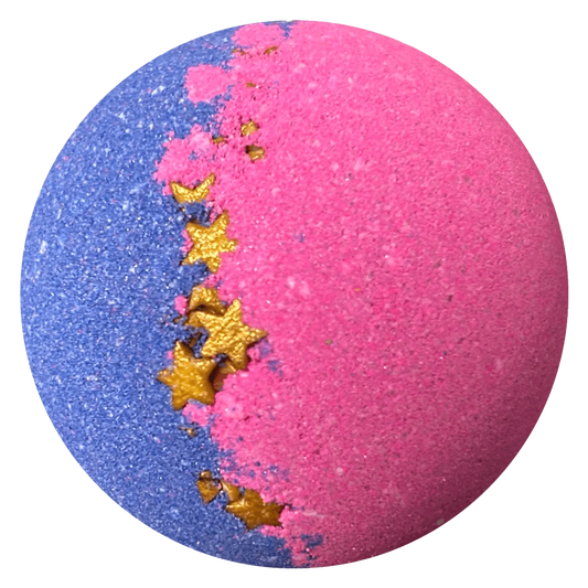 A spherical bath bomb with a split design, featuring a glittery blue half and a matte pink half, separated by a diagonal line decorated with metallic gold star and crescent moon pieces, set against a plain white background.