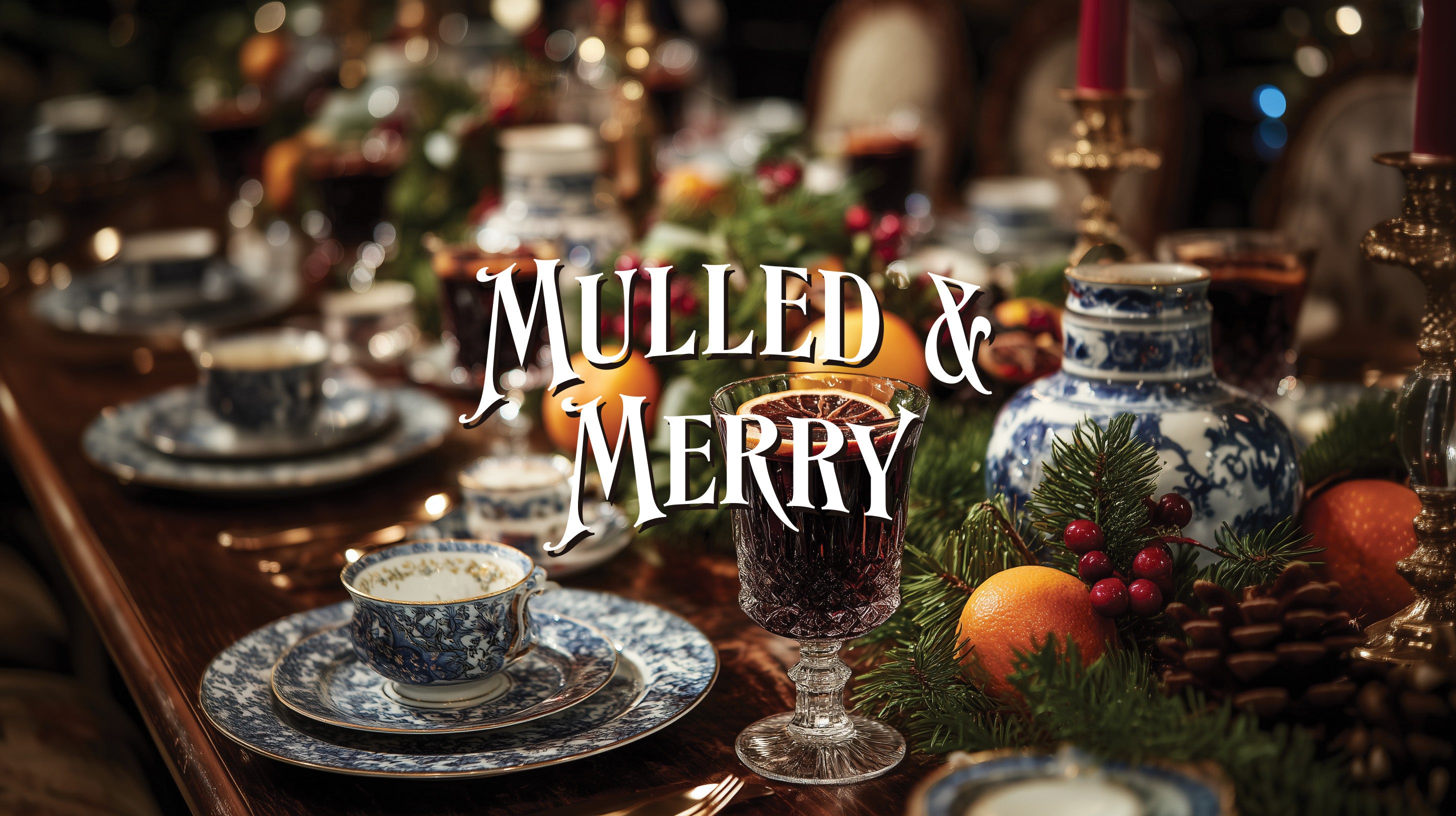 Decorative table setting with mulled wine and Christmas decorations, featuring the text 'Mulled & Merry'.