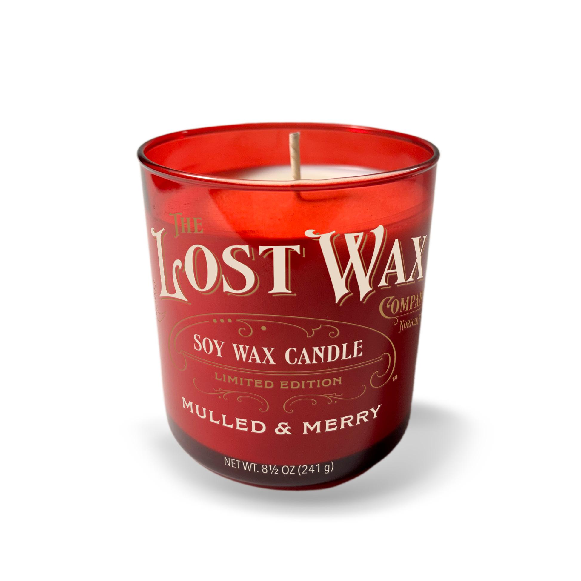 Red candle with 'The Lost Wax Company' branding on a white background