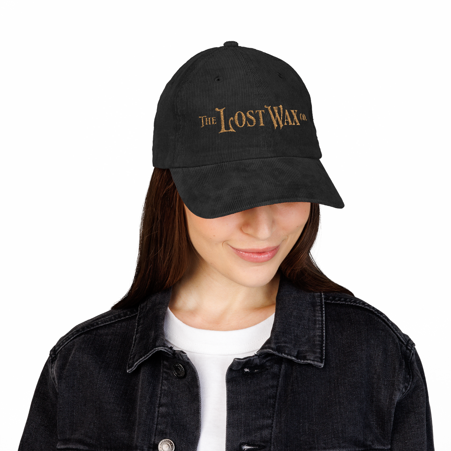 Person wearing a black cap with 'The Lost Wax' logo on a white background