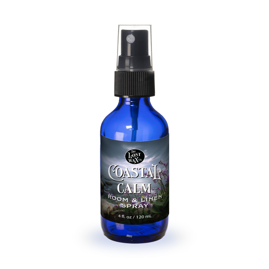 Blue spray bottle labeled 'Coastal Calm' on a white background