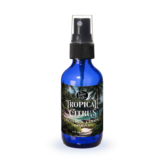 Blue spray bottle labeled 'Tropical Citrus' on a white background