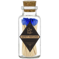 Glass jar with cork lid containing safety matches with blue tips and a visible brand label.