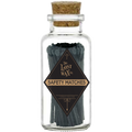 Glass jar with cork lid containing black safety matches labeled 'The Lost Wax Co.' on a white background.
