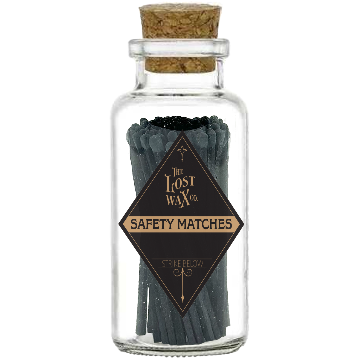 Glass jar with cork lid containing black safety matches labeled 'The Lost Wax Co.' on a white background.