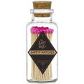 Glass jar with cork lid containing pink-tipped safety matches branded 'The Lost Wax Co'.