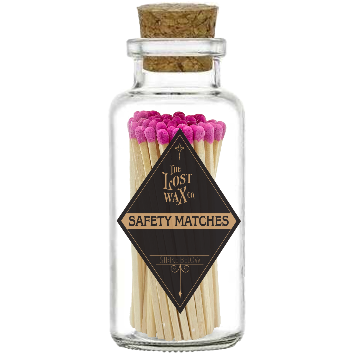 Glass jar with cork lid containing pink-tipped safety matches branded 'The Lost Wax Co'.