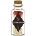 Glass jar with cork lid containing red safety matches branded 'The Lost Wax Co'.