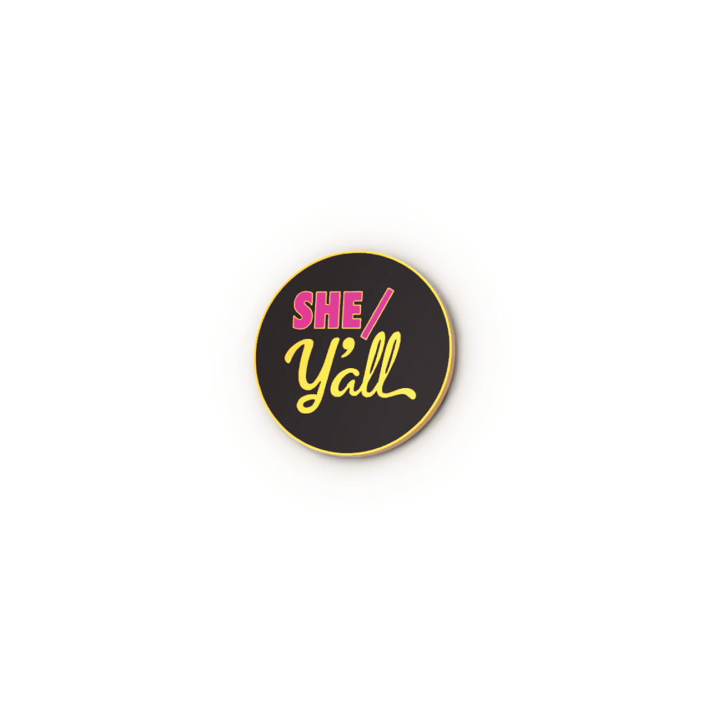Round black badge with 'SHE/Y'all' text on a white background