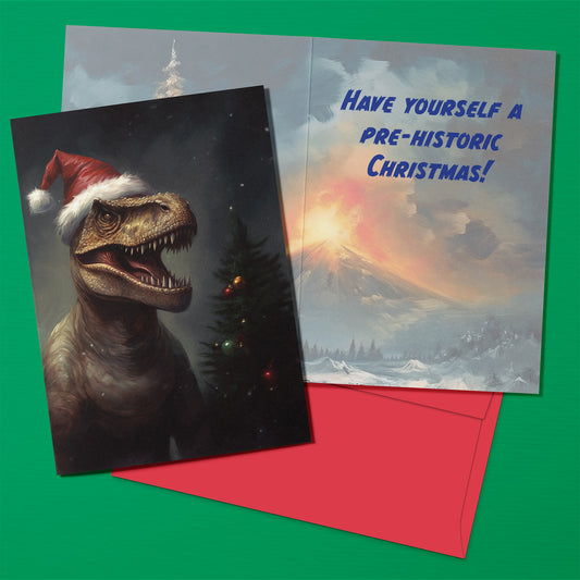 Christmas card with dinosaur wearing a Santa hat and text 'Have Yourself a Pre-Historic Christmas!' on a green background.