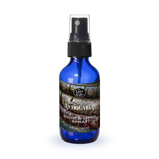 Blue spray bottle with a label on a white background