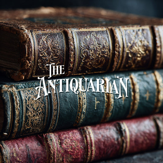 Stack of old books with decorative spines and 'The Antiquarian' text.
