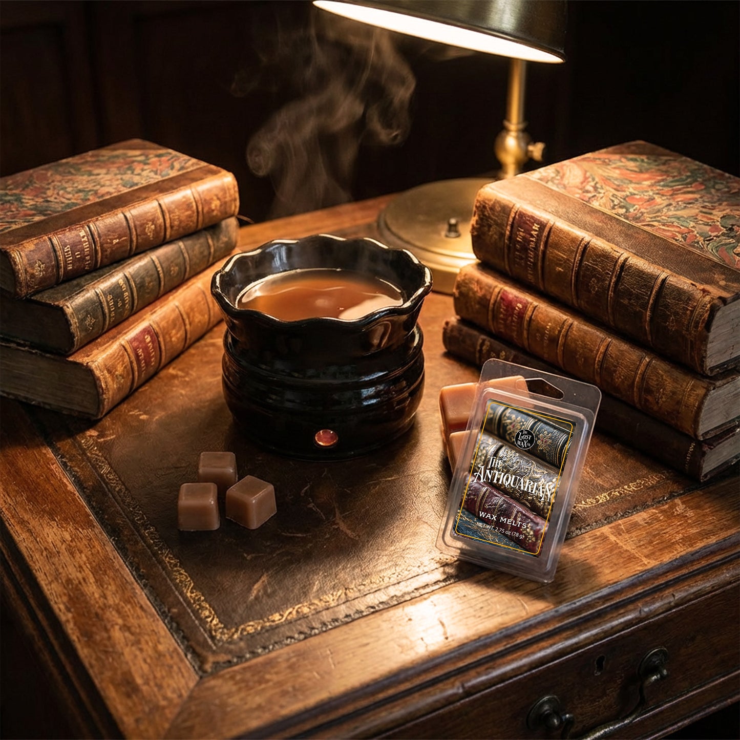 Wax melter on a wooden desk with old books and a lamp in the background