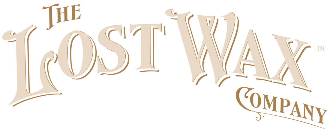 Logo of The Lost Wax Company in beige on a white background