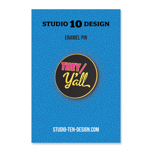 Enamel pin packaging with 'THEY/ Y'ALL' design on a blue background