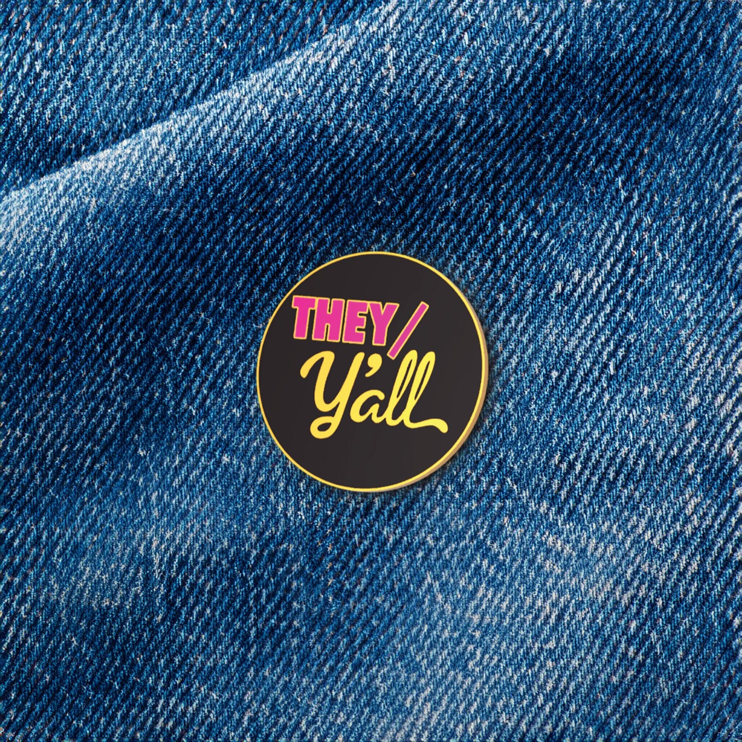 Pin with 'THEY/ Y'all' text on a denim background
