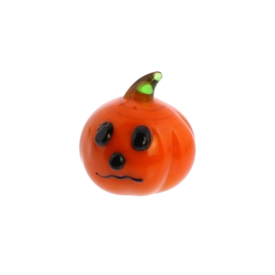 A small orange pumpkin-shaped accessory with a green stem and a simple black face, shown on a plain white background.