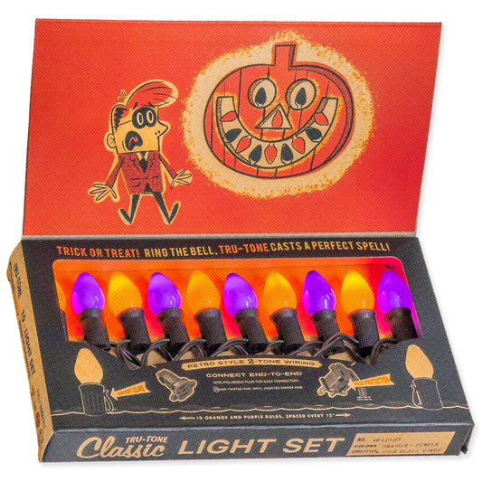 A boxed Tru-Tone Classic Light Set with eight retro-style bulb lights in orange, yellow, and purple, shown with the open red-and-black packaging and printed lid artwork.