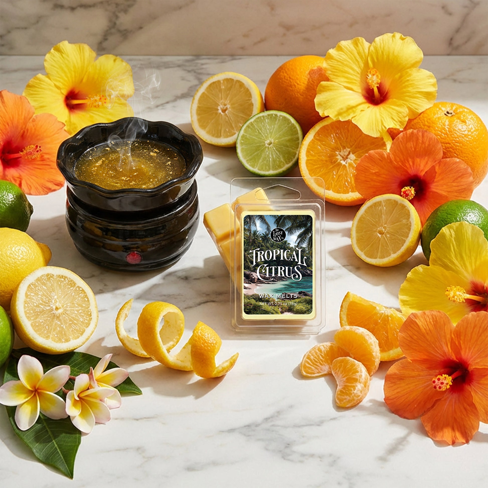Tropical Citrus Wax Melts with lemons, oranges, and flowers on a marble surface