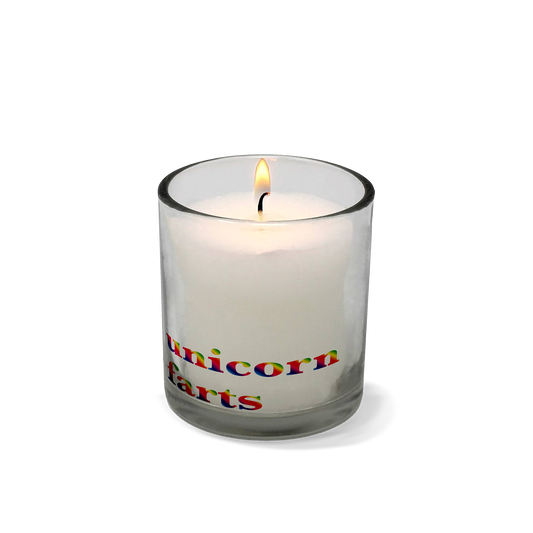 Candle in a glass holder with 'unicorn farts' text on a white background