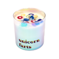 Rainbow iridescent candle with 'unicorn farts' text on a white background