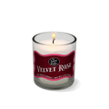 Candle in a glass jar with a red label on a white background