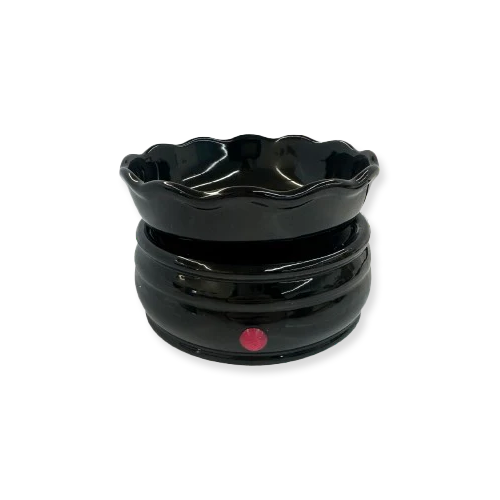 Black ceramic bowl with a red dot on a white background
