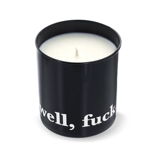 Candle in a black container with "well, fuck." text on a white background