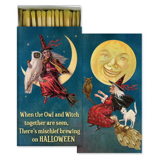 A decorative matchbox set with illustrated Halloween artwork: a witch in a red dress flying on a broomstick with an owl, a smiling moon, and a small white cat, with the text 'When the Owl and Witch together are seen, There's mischief brewing on HALLOWEEN.' The matches are visible at the top and the box is shown against a plain white background.