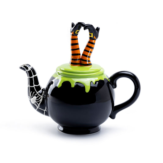 Black teapot with green lid and orange striped legs on a white background