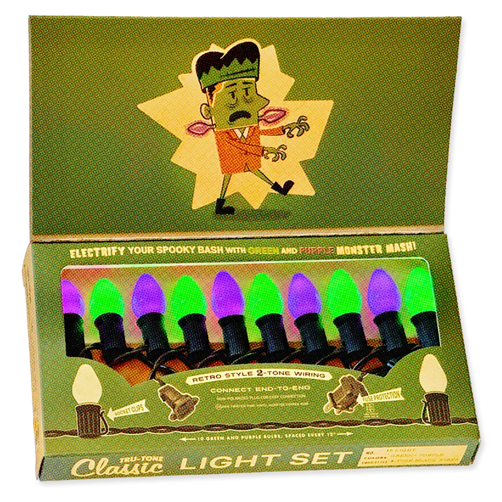 A boxed Halloween-style light set with cartoon Frankenstein graphics on the packaging. The open box shows multiple bulb-shaped lights in green and purple colors, with text reading 'Electrify Your Spooky Bash with Green and Purple Monster Mash!' and 'Tri-Tone Classic Light Set.