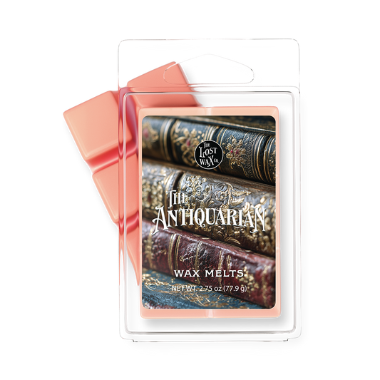 Wax Melt package with 'The Antiquarian' design featuring stacked books on a white background